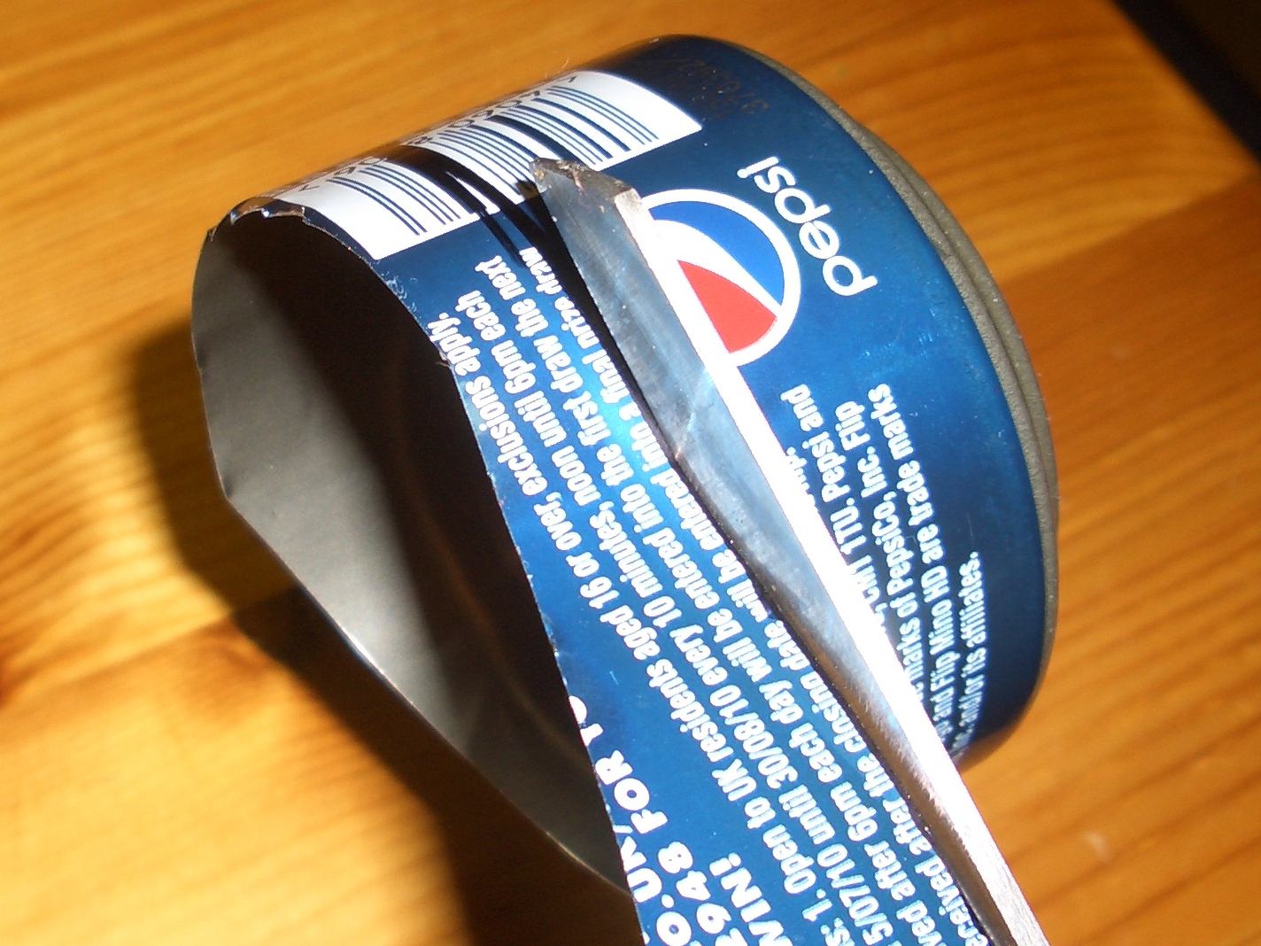 Using Scissors to cut cans down
