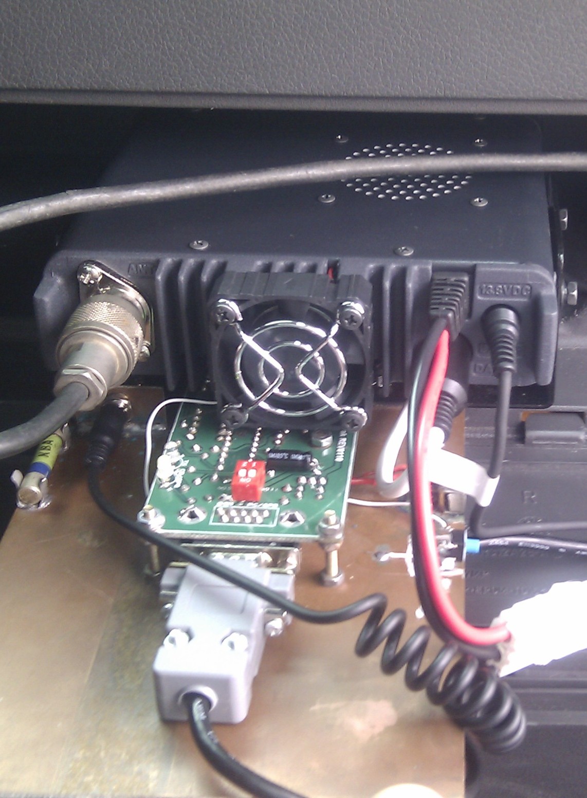 Radio and Tracker in car boot